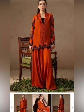 Elegant Orange Pakistani Dress with Black Embroidery